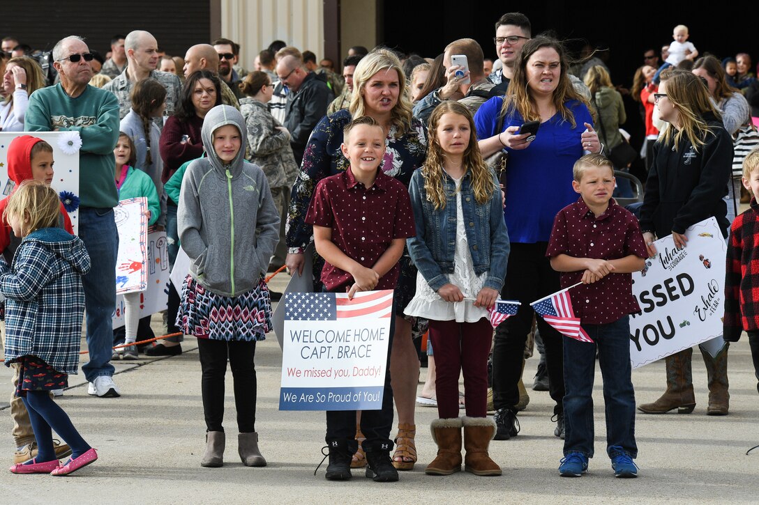 Friends and family await the return of Airmen assigned to the 729th Air Control Squadron at Hill Air Force Base, Utah, April 29, 2019, following the unit's 7-month Middle East deployment . While deployed, 729th ACS Airmen provided aircraft control and air surveillance across a 1.1 million square miles of U.S. Air Force Central Command airspace. (U.S. Air Force photo by R. Nial Bradshaw)