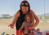 Volunteers create arts and crafts during a volunteer of the year event at Victory Field, Marine Corps Air Ground Combat Center, Twentynine Palms, Calif., April 24, 2019. The American Friends of our Armed Forces (AFAF) sponsored the award ceremony to show appreciation for AFAF volunteers and staff. (U.S. Marine Corps photo by Lance Cpl. Robin Lewis)