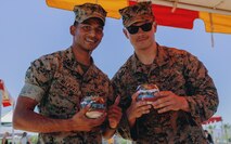 U.S. Marine Sgt. Mahesh Nelapati, and Cpl. Thomas Konkel, 3rd Battalion, 7th Marine Regiment, 1st Marine Division, pose for a photo at Victory Field, Marine Corps Air Ground Combat Center, Twentynine Palms, Calif., April 24, 2019. The American Friends of our Armed Forces (AFAF) sponsored the award ceremony to show appreciation for AFAF volunteers and staff. (U.S. Marine Corps photo by Lance Cpl. Robin Lewis)