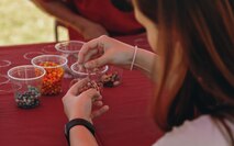 Volunteers create arts and crafts during a volunteer of the year event at Victory Field, Marine Corps Air Ground Combat Center, Twentynine Palms, Calif., April 24, 2019. The American Friends of our Armed Forces (AFAF) sponsored the award ceremony to show appreciation for AFAF volunteers and staff. (U.S. Marine Corps photo by Lance Cpl. Robin Lewis)