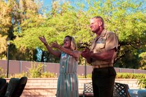 U.S. Marine Corps Brig. Gen. Roger Turner, commanding general, Marine Air Ground Task Force Training Center (MAGTFTC), Marine Corps Air Ground Combat Center (MCAGCC), Twentynine Palms, Calif., and his wife, Carol Turner, applaud Marines who volunteered to host an Earth Day celebration at their home, April 24, 2019. The event was part of MCAGCC’s annual observance of Earth Day which includes multiple events aimed at fostering awareness of environmental conservation on and around the Marine Corp’s largest training installation. (U.S. Marine Corps photo by Cpl. Dallas Johnson)