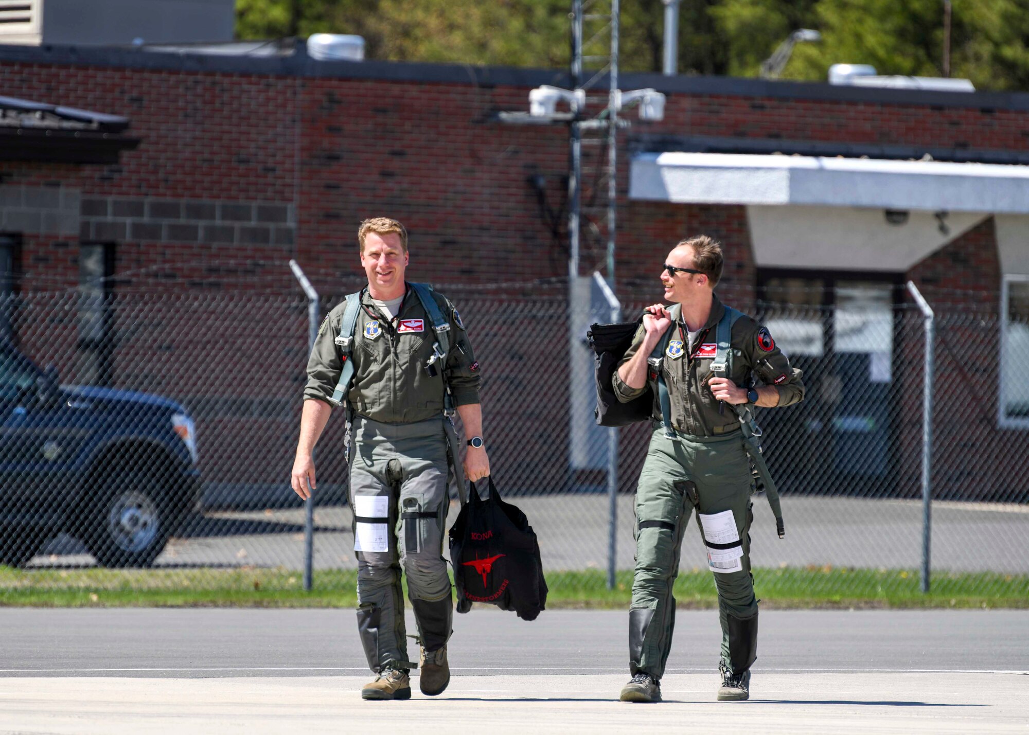 Lt. Col. Nathaniel 'Kona' Zajac and Maj. Mark 'Mr. Chow' Silvers, 104th Fighter Wing pilots, walk onto the flight line prior to training with the Royal Canadian Air Force April 25, 2019, at Barnes Air National Guard Base, Massachusetts. The 104th FW and the RCAF spent five days conducting dissimilar aircraft training together.