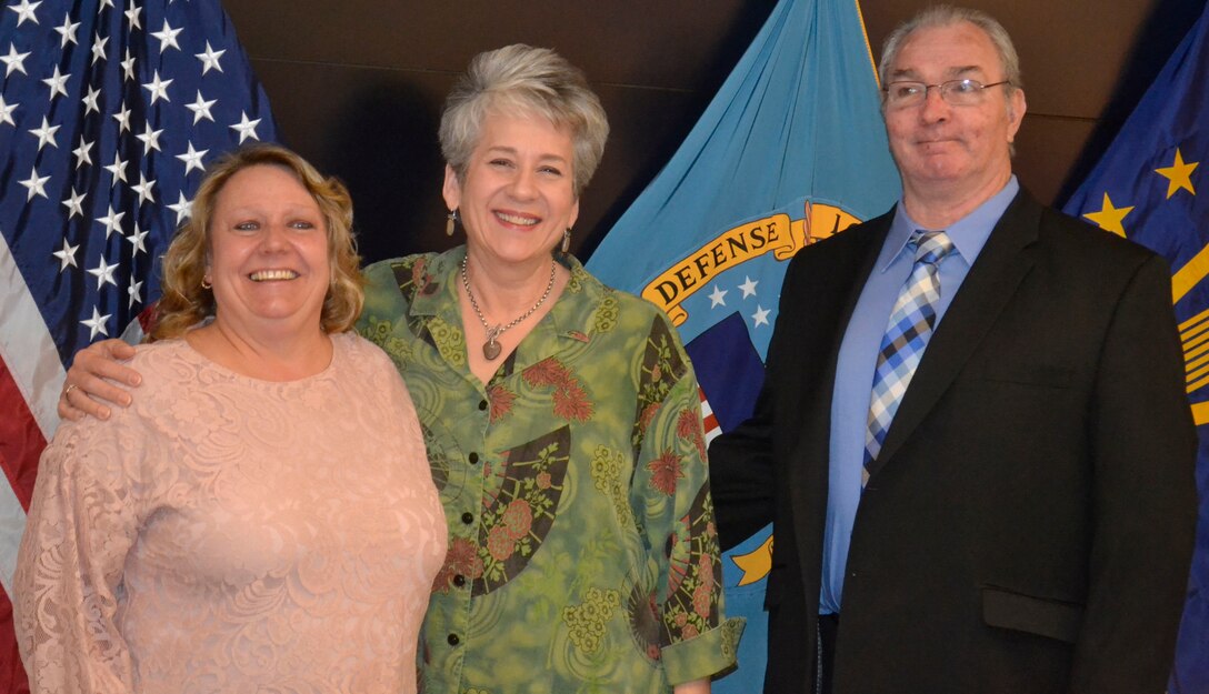 Susanne McHale, Susan Paul and Michael Newell, pictured left to right, pose after a retirement ceremony in their honor at DLA Troop Support in Philadelphia April 25, 2019.