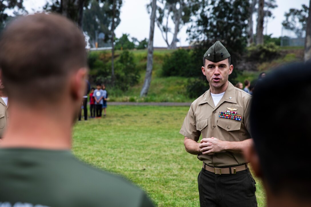 Lt. Col. Alan J. Clarke, commanding officer of Headquarters and Headquarters Squadron, Marine Corps Air Station Miramar, addresses the Marines after a fitness challenge session at Miramar Ranch Elementary School in San Diego, April 26. The Marines came together for the Single Marine Program’s 5th annual “Days of Service” event, which involves Marines going to different locations off of the installation and doing their part in keeping the environment clean. (U.S. Marine Corps photo by Cpl. Preston Hightower)