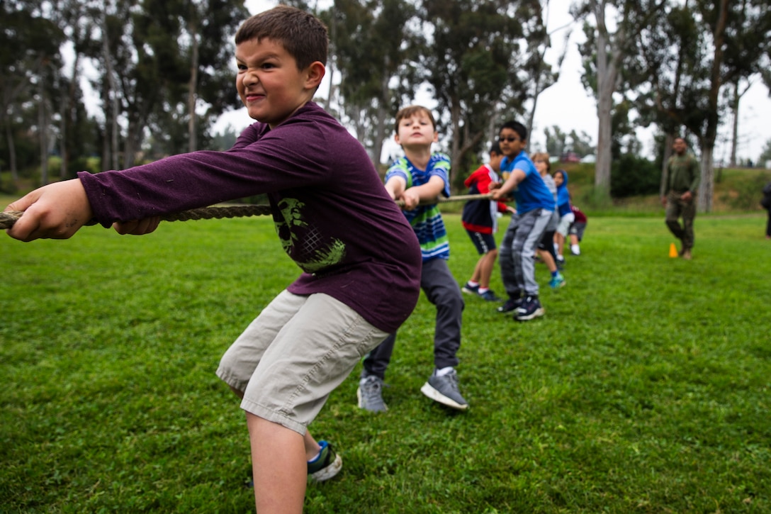 Marines from Marine Corps Air Station Miramar engage in a fitness challenge during the “Days of Service” event at Miramar Ranch Elementary School in San Diego, April 26. The Marines came together for the Single Marine Program’s 5th annual “Days of Service” event, which involves Marines going to different locations off of the installation and doing their part in keeping the environment clean. (U.S. Marine Corps photo by Cpl. Preston Hightower)