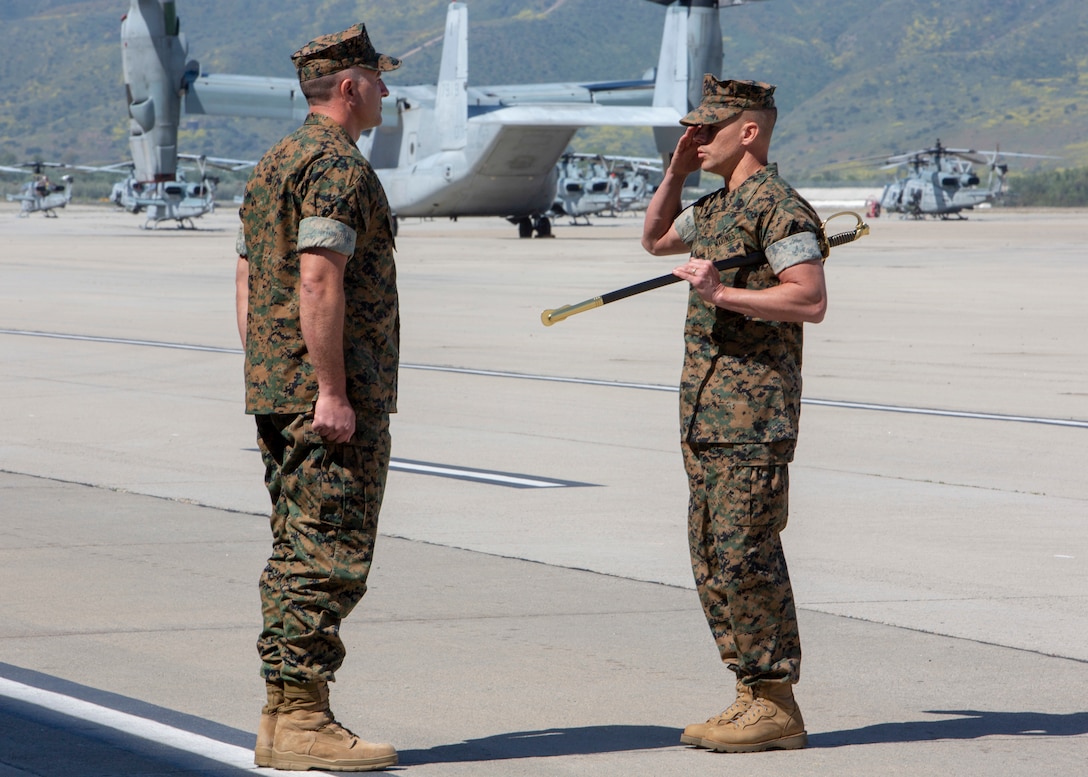Sgt. Maj. David White, Marine Medium Tiltrotor Squadron (VMM) 164, Marine Aircraft Group 39, 3rd Marine Aircraft Wing, salutes Lt. Col. Michael Crivello during White’s relief and appointment ceremony at Marine Corps Air Station Camp Pendleton, Calif., April 25, 2019. The passing of the noncommissioned officer sword signifies relinquishment of his post. White relinquished his post as the VMM-164 sergeant major to Sgt. Maj. Jeffery Vandentop. (U.S. Marine Corps photo by Sgt. Charnelle Smith/Released)