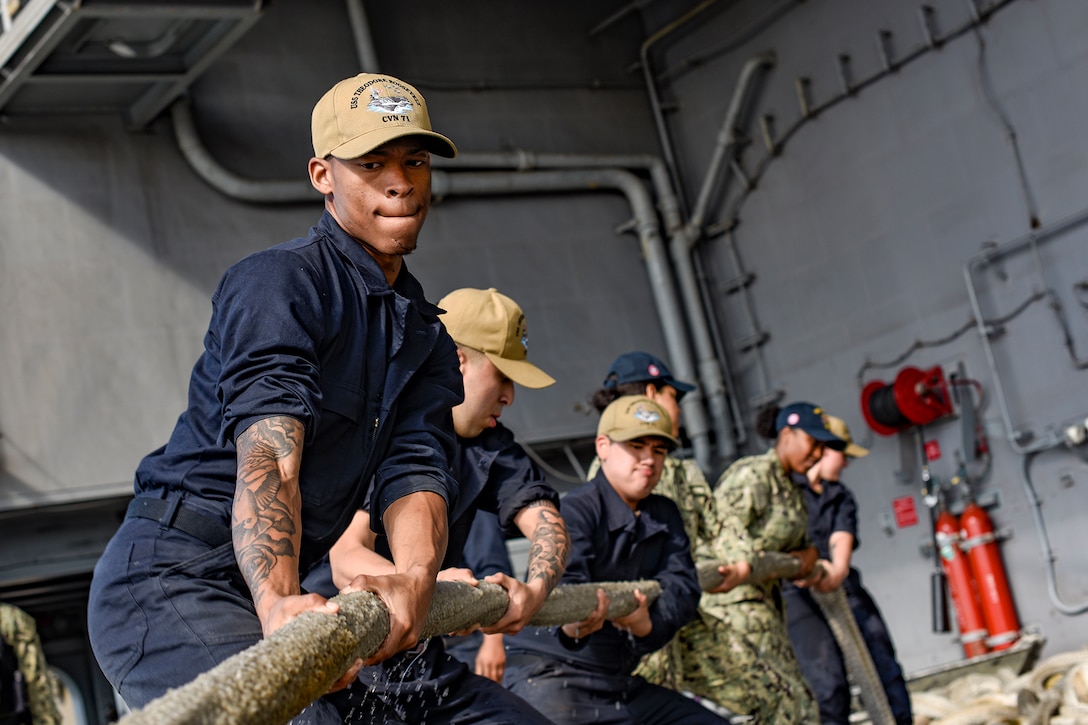 Sailors heave a line.