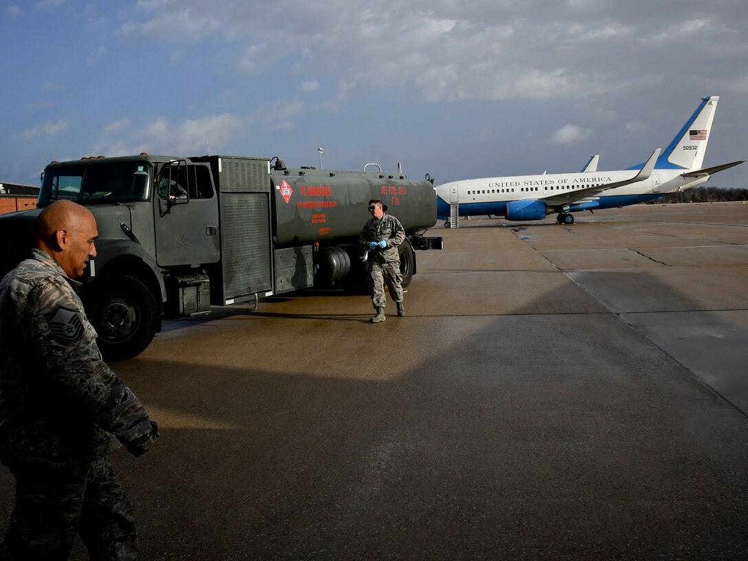 Fuels specialist pull up with a jet fuel truck to pump gas to a waiting C-40 airplane March 14, 2019 at Scott Air Force Base, Illinois.  Maintainers are constantly perfecting their mission: The 932nd Airlift Wing's Maintenance Group (MXG), is responsible for leading people who are always training and equipping to inspect, maintain and repair Air Force Reserve Command C-40C planes at Scott Air Force Base. The 932nd MXG's management of resources improves the wing's professionalism and enables the 932nd Operations Group's C-40C pilots to fly distinguished visitor (DV) airlift around the world, anywhere they are needed by the nation's leaders. The Illinois unit, which is part of 22nd Air Force, under Air Force Reserve Command, flies four of the C-40C planes worldwide. (U.S. Air Force photo by Lt. Col. Stan Paregien)