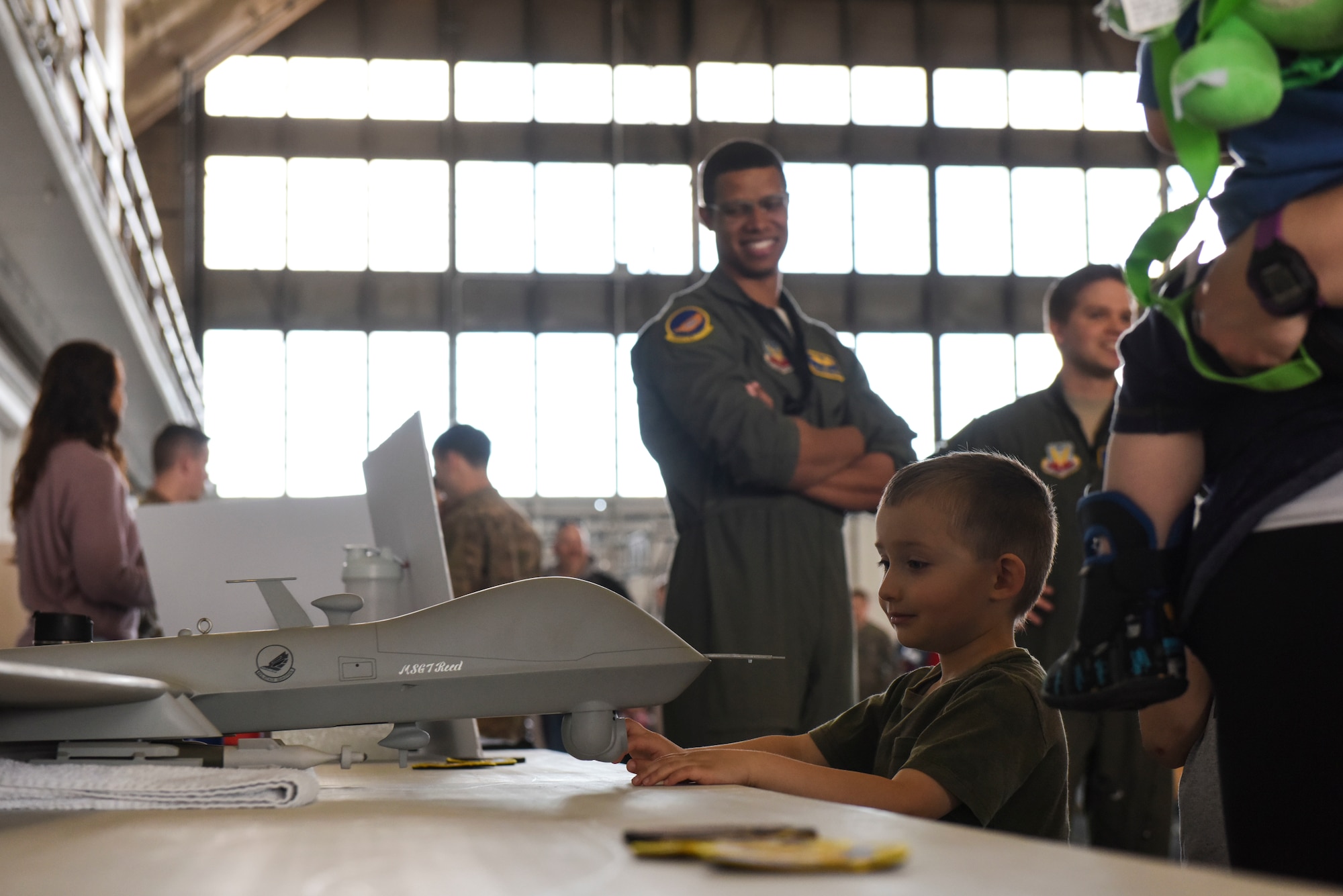 A child observes a model MQ-9 Reaper put on display by the 89th Arrack Squadron during a Doolittle Raider Anniversary Celebration at Ellsworth Air Force Base, South Dakota, April 18, 2019. The 89th ATKS, formerly known as the 89th Reconnaissance Squadron, was one of four original Doolittle Raider squadrons during the 1942 attacks. (U.S. Air Force photo by 1st Lt. Scarlett Trujillo)