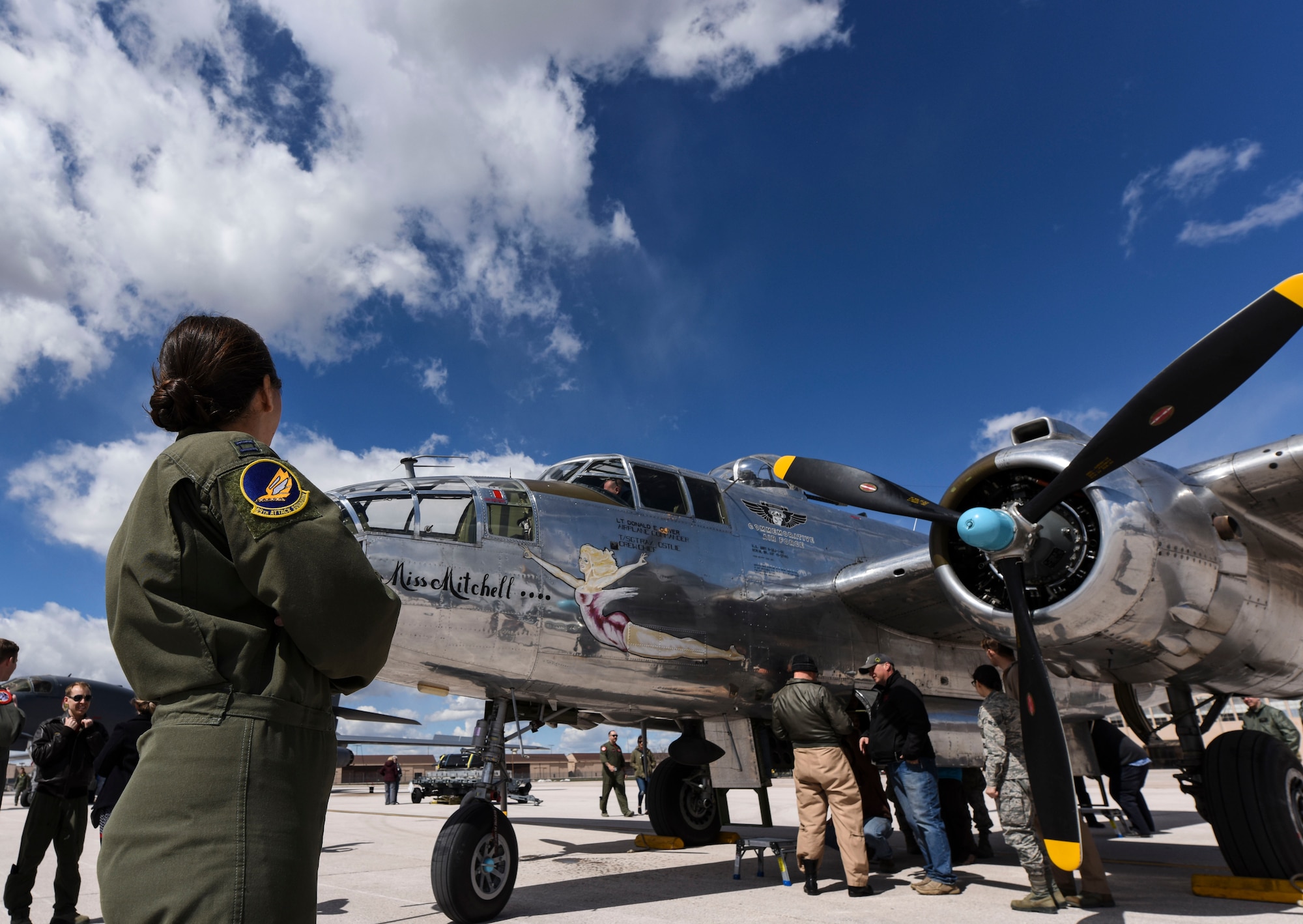 Capt. Sophie, pilot with the 89th Attack Squadron, surveys the B-25B Mitchell on display during a Doolittle Raider Anniversary Celebration at Ellsworth Air Force Base, South Dakota, April 18, 2019. Sixteen B-25B's were used in the Doolittle Raids, and out of those, four belonged to the 89th Reconnaissance Squadron.