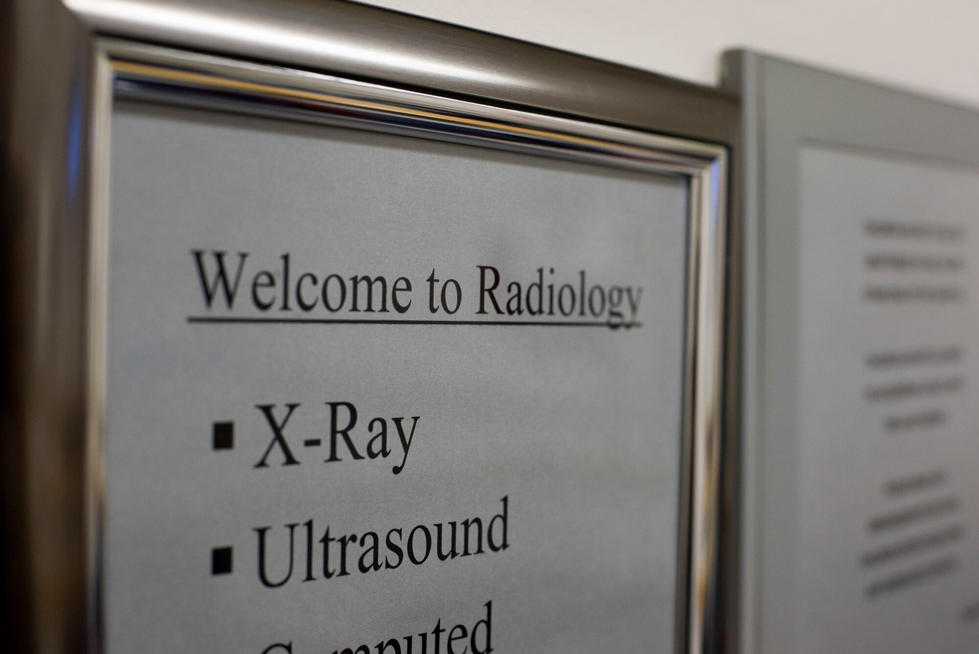 A radiology sign hangs on a wall at Misawa Air Base, Japan, April 11, 2018. The 35th Medical Group radiology flight implemented the Continuous Process Improvement Pacific Ultrasound Peer Review program at Misawa AB, last year. The program allows all Pacific Air Forces ultrasound technicians, sonographers and radiologists to evaluate each other’s previously performed exams which standardizes imaging protocol across the Indo-Pacific. (U.S. Air Force photo by Senior Airman Collette Brooks)