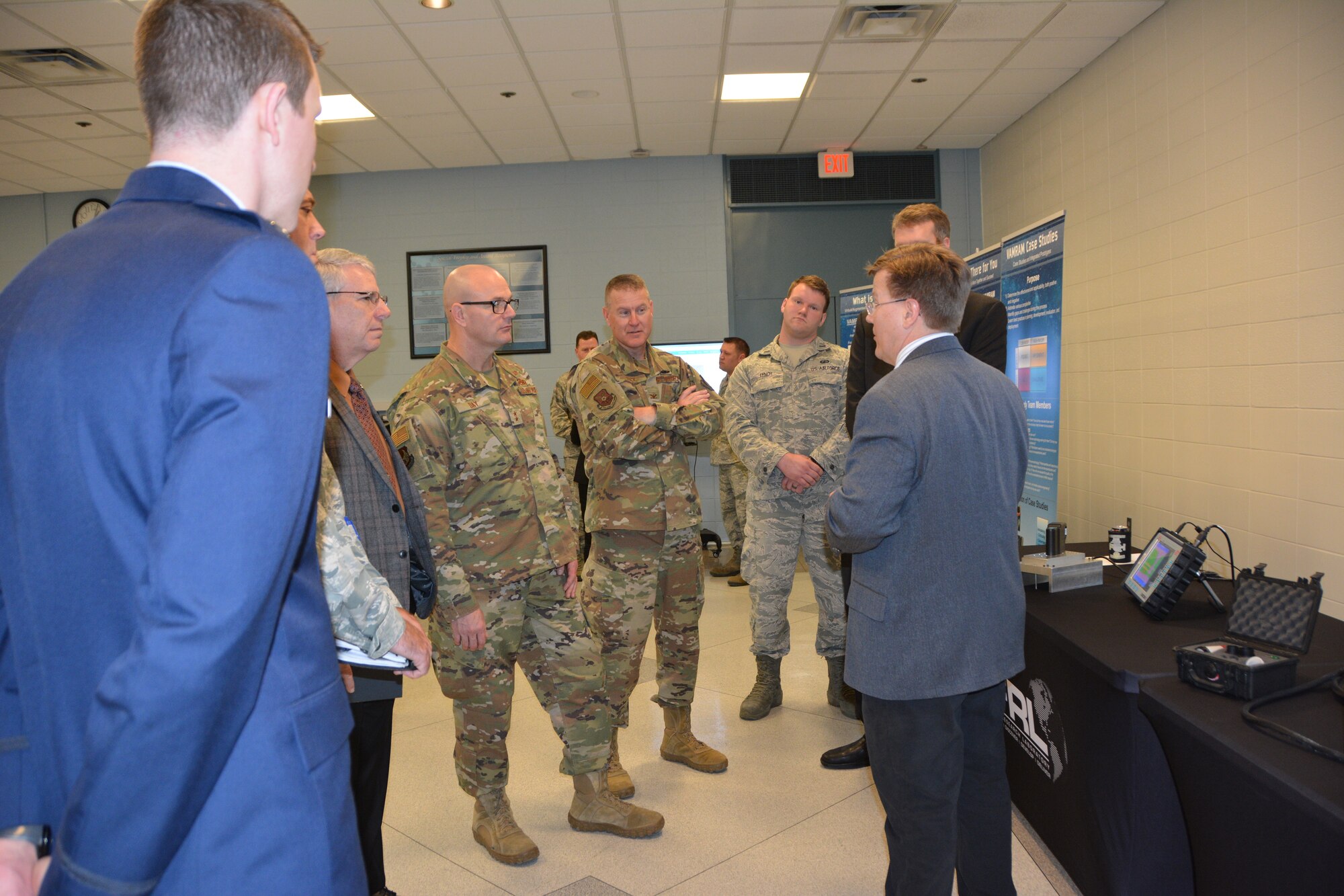Dr. Eric Lindgren, of the Air Force Research Laboratory, demonstrates the non-destructive inspection/evaluation process to senior leaders from across the Air Force. The demo was part of an AFRL Tech Expo for the Basing and Logistics Board. (U.S. Air Force photo/Karen Schlesinger)