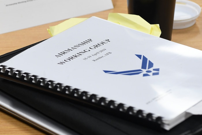 An Airmanship working group notebook is displayed on a desk inside the Professional Development Center at Keesler Air Force Base, Mississippi, April 19, 2019. U.S. Air Force Senior Master Sgt. Kevin Lambert, 81st Security Forces Squadron operations superintendent, collected curriculum from different learning agencies across the Air Force and consolidated the information in a notebook for review. Approximately 25 people attended the working group focused on redefining Airmanship in order to build better Airmen. (U.S. Air Force photo by Senior Airman Suzie Plotnikov)