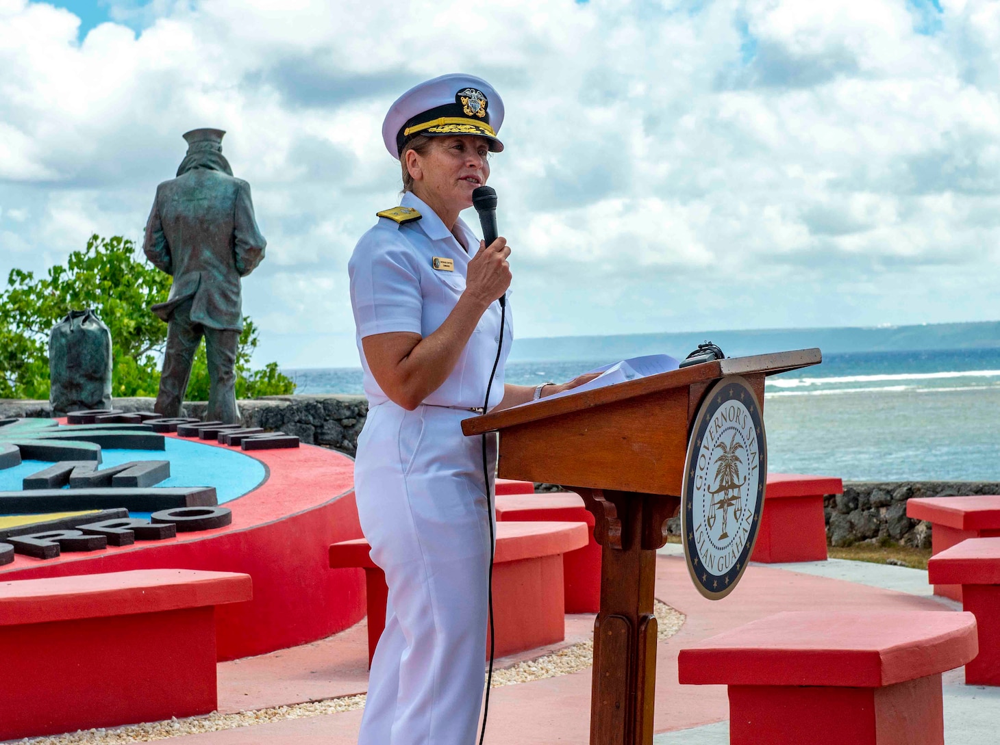 HAGÅTÑA, Guam (April 30, 2019) – Rear Adm. Shoshana Chatfield, commander, Joint Region Marianas, delivers remarks during an unveiling of the official plaques for the Lone Sailor statue at the Ricardo J. Bordallo Governor's
Complex in Hagåtña April 30. Local and military officials, and members of the Vietnamese-American community, attended the event at Lone Sailor statue, a symbol of the significant relationship between the Navy, the sea services, Guam, and the thousands of Vietnamese citizens who found refuge on the island during Operation New Life in the ending days of the Vietnam War.