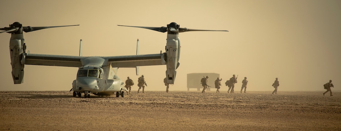 U.S. Marines with Charlie Company, 1st Battalion, 7th Marines, attached to Special Purpose Marine Air Ground Task Force Crisis Response-Central Command, disembark an MV-22 Osprey during a tactical recovery of aircraft and personnel exercise at Camp Buehring, Kuwait, April 28, 2019. The SPMAGTF-CR-CC is a multiple force provider designed to employ ground, logistics and air capabilities throughout the Central Command area of responsibility.