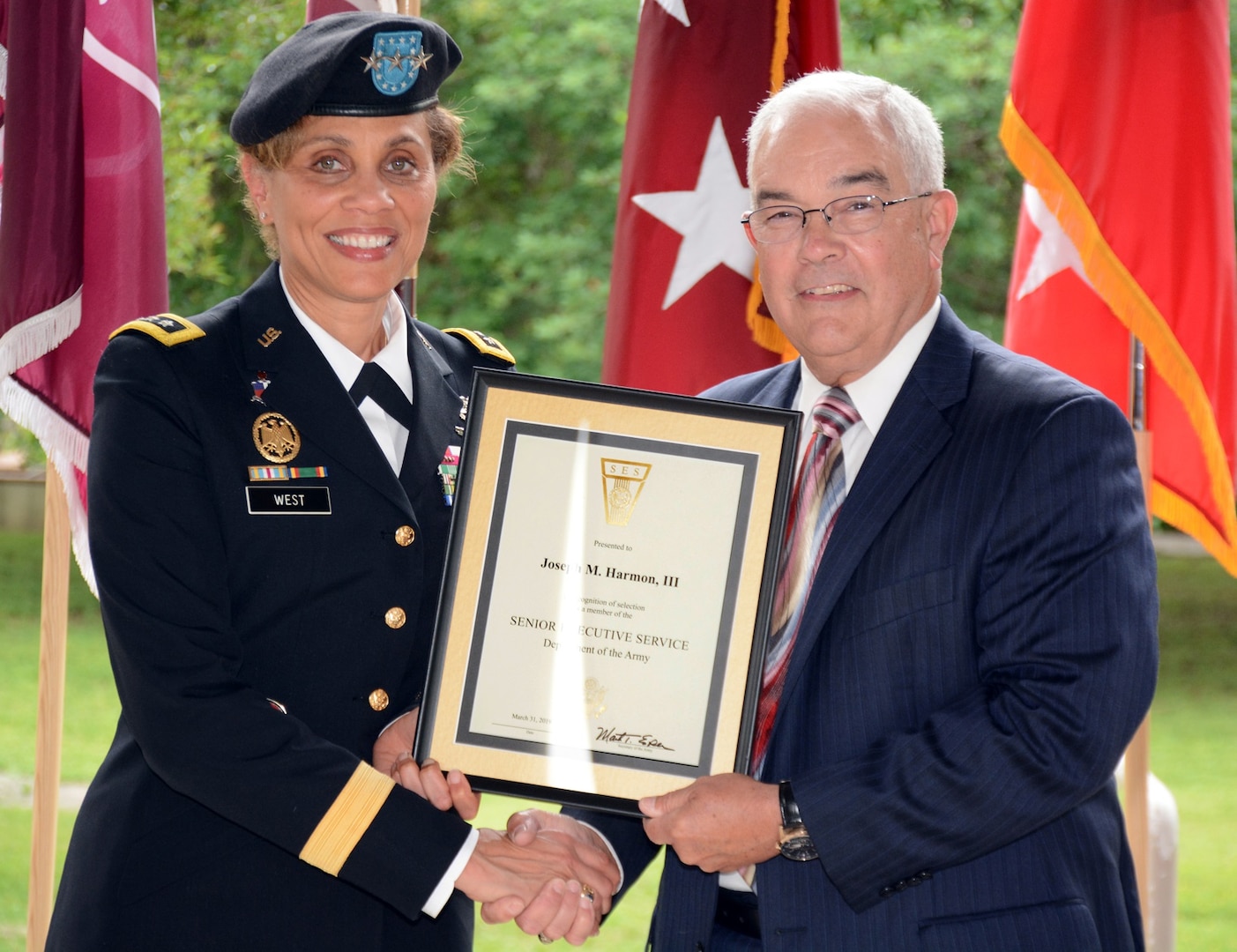 Lt. Gen. Nadja Y. West, The Surgeon General of the U.S. Army and commanding general, U.S. Army Medical Command, congratulates Joseph M. Harmon III, deputy to the Commanding General, U.S. Army Medical Department Center and School, Health Readiness Center of Excellence. Harmon was appointed to the Senior Executive Service in a ceremony at the Army Medical Department Museum April 29.