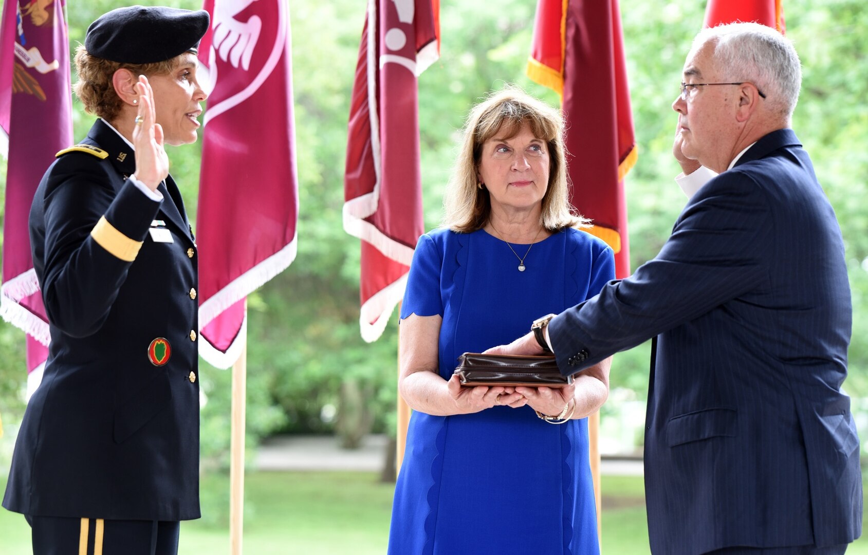 Lt. Gen. Nadja Y. West administers the oath of office to Joseph M. Harmon III, as his wife Alice looks on. Harmon, deputy to the Commanding General, U.S. Army Medical Department Center and School, Health Readiness Center of Excellence, or HRCoE, at Joint Base San Antonio-Fort Sam Houston, was appointed to the Senior Executive Service in a ceremony at the Army Medical Department Museum April 29.