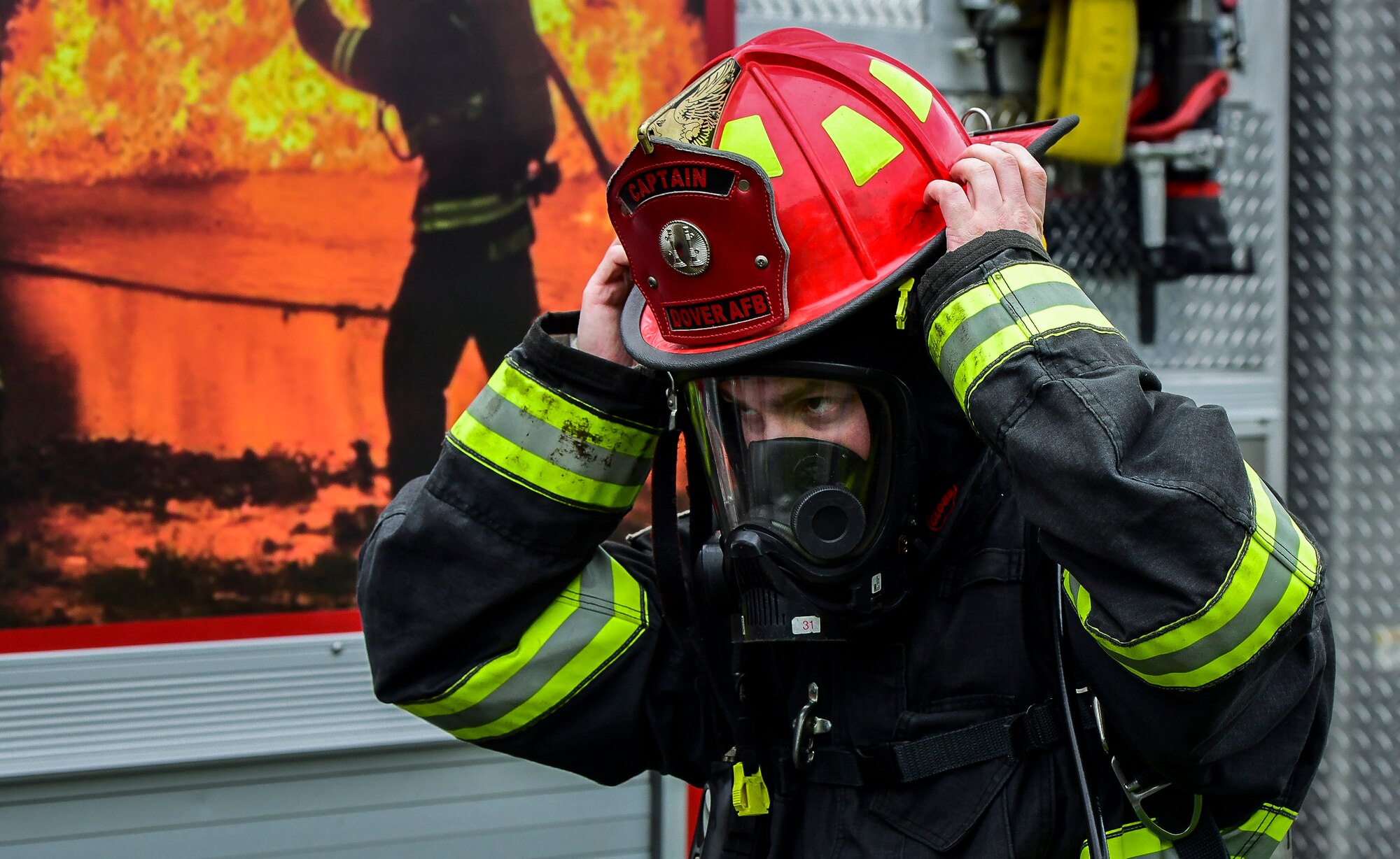 Staff Sgt. Scott Thompson, 436th Civil Engineer Squadron crew chief, prepares for an indoor simulated-fire scenario April 26, 2019, at Dover Air Force Base, Del. The 436th CES firefighters conduct frequent training scenarios that include battling interior and exterior fires. (U.S. Air Force photo by Senior Airman Christopher Quail)