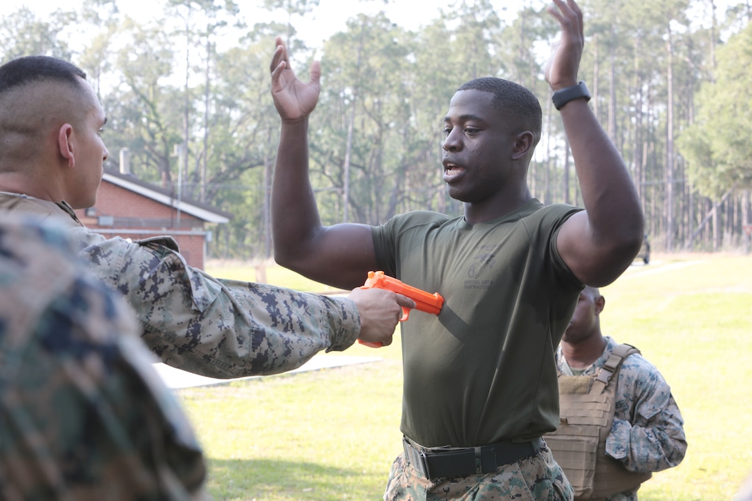 For three straight weeks, several Marines aboard Marine Corps Logistics Base Albany put their combat fighting skills to the test to secure the highest belt level in the U.S. Marine Corps Martial Arts Program. Out of 21 Marines who signed up for the gut-wrenching MCMAP training, 15 graduated with advanced belts, April 29. (U.S. Marine Corps photo by Re-Essa Buckels)