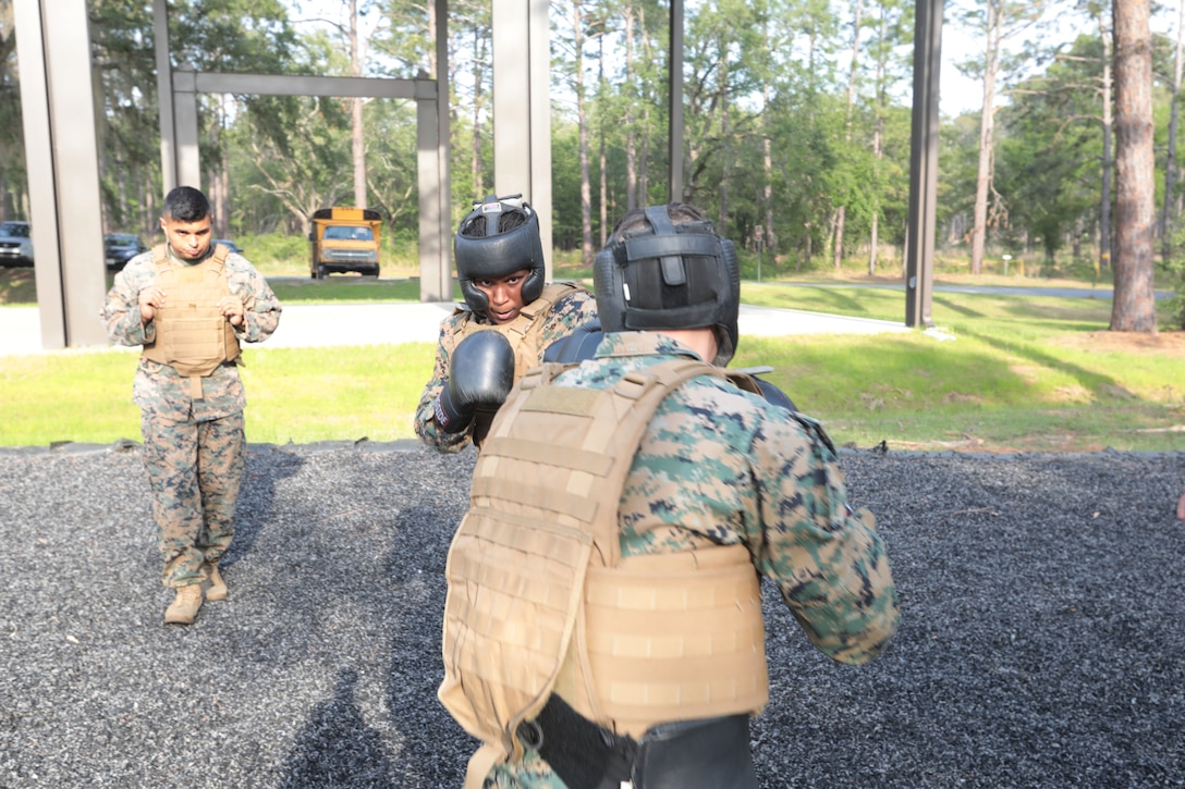 For three straight weeks, several Marines aboard Marine Corps Logistics Base Albany put their combat fighting skills to the test to secure the highest belt level in the U.S. Marine Corps Martial Arts Program. Out of 21 Marines who signed up for the gut-wrenching MCMAP training, 15 graduated with advanced belts, April 29. (U.S. Marine Corps photo by Re-Essa Buckels)