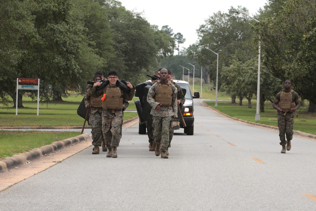 For three straight weeks, several Marines aboard Marine Corps Logistics Base Albany put their combat fighting skills to the test to secure the highest belt level in the U.S. Marine Corps Martial Arts Program. Out of 21 Marines who signed up for the gut-wrenching MCMAP training, 15 graduated with advanced belts, April 29. (U.S. Marine Corps photo by Re-Essa Buckels)