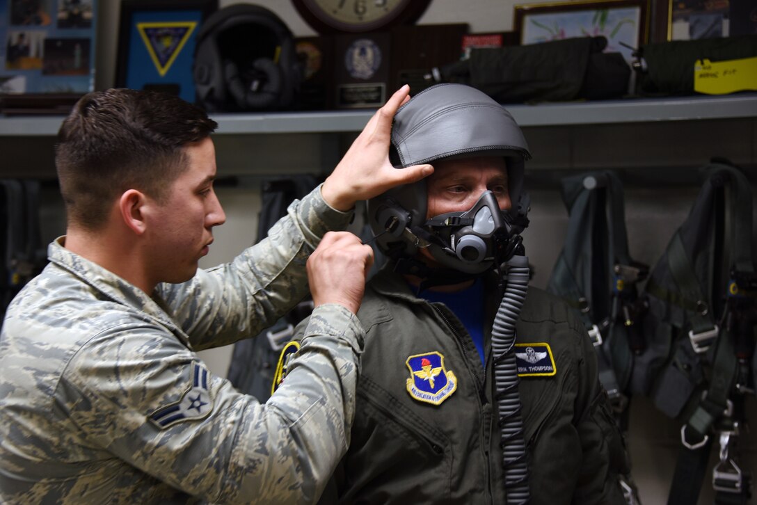 Airman 1st Class Amadeus Rosa Rosa, 80th Operations Support Squadron aircrew flight equipment technician, ensures 19th Air Force Command Chief Master Sgt. Erik Thomson’s oxygen mask has a proper fit before his familiarization flight, April 26, 2019 at Sheppard Air Force Base, Texas. A set of pilot equipment consists of a helmet, mask, parachute and G-suit, more than 140 sets are inspected weekly. (U.S. Air Force photo by Senior Airman Robert L. McIlrath)