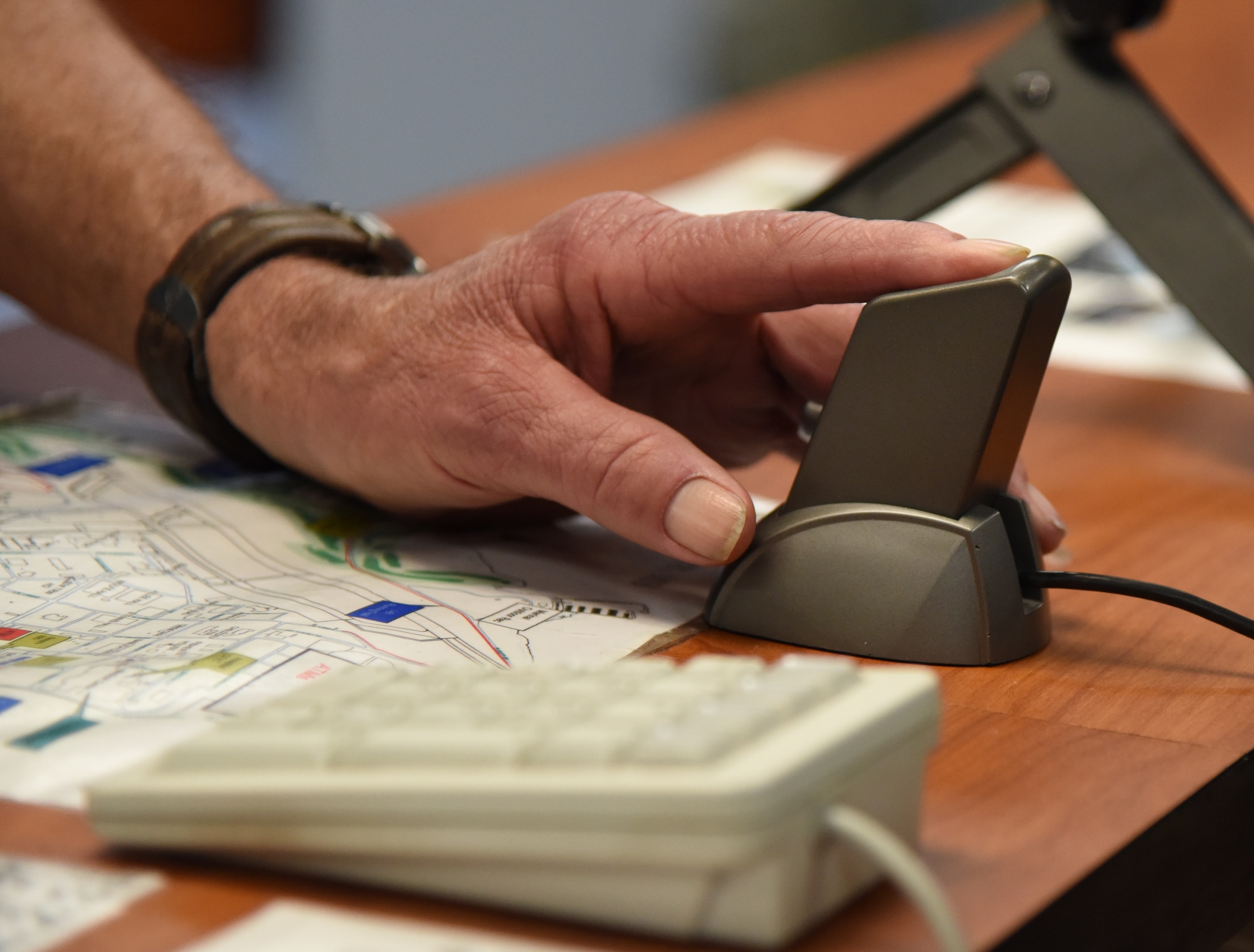 Ashton Belcher, brother of U.S. Air Force Maj. Robert Belcher, provides his fingerprint sample while applying for a Gold Star Family Member ID card inside the Visitors Center at Keesler Air Force Base, Mississippi, April 26, 2019. Robert was an F-4 pilot who served during the Vietnam War and was placed in POW/MIA status following his disappearance while on a mission to mark targets in 1969. As a surviving brother of a POW/MIA service member, Ashton is allowed to obtain a Gold Star Family Member ID card for recognition and installation access so that he can attend events and access Airman & Family Readiness Center referral services. (U.S. Air Force photo by Kemberly Groue)