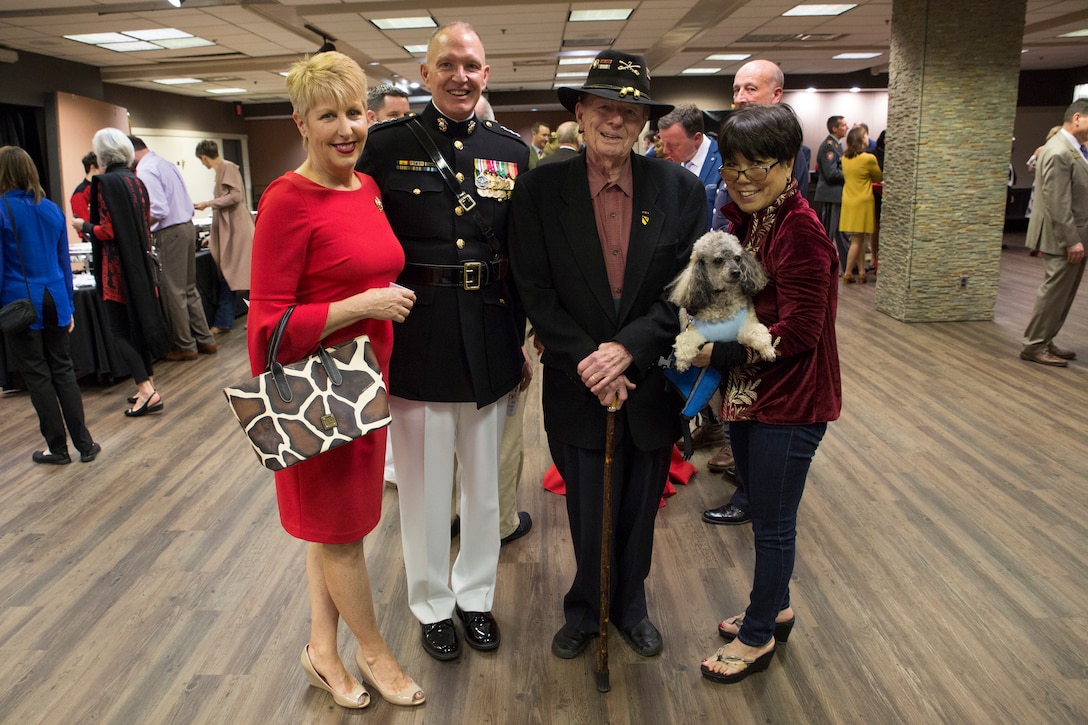 U.S. Marine Corps Forces Command Commanding General Lt. Gen. Mark Brilakis, center left, poses for a photo with Joseph Galloway, the author of ‘We Were Soldiers’, center right, and their wives prior to the 2019 Virginia International Tattoo at the Norfolk Scope in Norfolk, Virginia, April 26, 2019. Brilakis took part in the Honorary Salute alongside U.S. Air Force Lt. Gen. Christopher Weggeman, the deputy commander of Air Combat Command, and Swiss Army Major General Peter Wanner. This year’s festival was dedicated to women in the military. (U.S. Marine Corps photo by Cpl. Danielle Prentice/ Released)