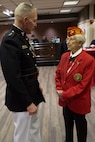 U.S. Marine Corps Forces Command Commanding General Lt. Gen. Mark Brilakis, left, talks to U.S. Marine Corps Reserves Sgt. Miriam Guilfoyl Triscritti, an honorary chair, prior to the 2019 Virginia International Tattoo at the Norfolk Scope in Norfolk, Virginia, April 26, 2019.