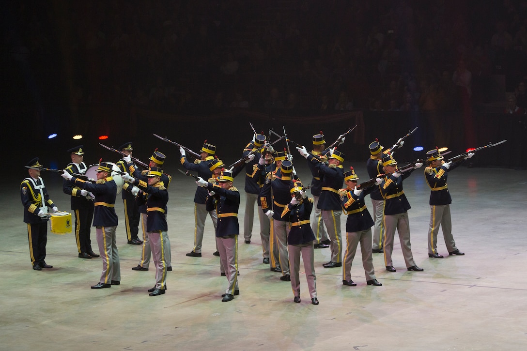 The 30th Guard Brigade Drill Team “Mihai Viteazul” of the Romanian Army performs during 2019 Virginia International Tattoo at the Norfolk Scope in Norfolk, Virginia, April 26, 2019. This year’s festival was dedicated to women in the military. The festival provided vast cultural traditions to its audience, and brings performers from around the world together to celebrate their partnership. (U.S. Marine Corps photo by Cpl. Danielle Prentice/ Released)