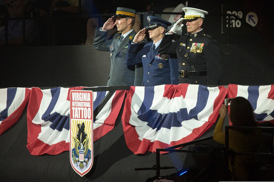 U.S. Marine Corps Forces Command Commanding General Lt. Gen. Mark Brilakis, right, takes the Honorary Salute alongside U.S. Air Force Lt. Gen. Christopher Weggeman, the deputy commander of Air Combat Command, and Swiss Army Major General Peter Wanner during the 2019 Virginia International Tattoo at the Norfolk Scope in Norfolk, Virginia, April 26, 2019. This year’s festival was dedicated to women in the military. (U.S. Marine Corps photo by Cpl. Danielle Prentice/ Released)