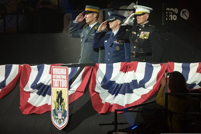 U.S. Marine Corps Forces Command Commanding General Lt. Gen. Mark Brilakis, right, takes the Honorary Salute alongside U.S. Air Force Lt. Gen. Christopher Weggeman, the deputy commander of Air Combat Command, and Swiss Army Major General Peter Wanner during the 2019 Virginia International Tattoo at the Norfolk Scope in Norfolk, Virginia, April 26, 2019.