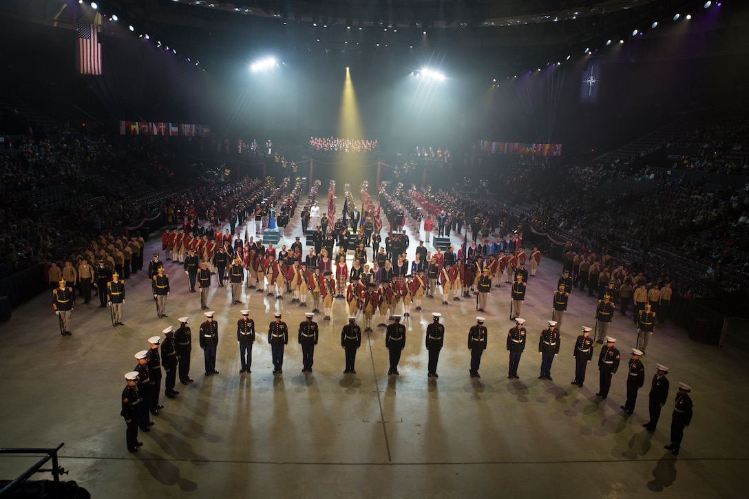All performers stand in formation during the finale of the 2019 Virginia International Tattoo at the Norfolk Scope in Norfolk, Virginia. Brilakis took part in the Honorary Salute alongside U.S. Air Force Lt. Gen. Christopher Weggeman, the deputy commander of Air Combat Command, and Swiss Army Major General Peter Wanner,  April 26, 2019. This year’s festival was dedicated to women in the military. (U.S. Marine Corps photo by Cpl. Danielle Prentice/ Released)