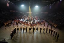 All performers stand in formation during the finale of the 2019 Virginia International Tattoo at the Norfolk Scope in Norfolk, Virginia. Brilakis took part in the Honorary Salute alongside U.S. Air Force Lt. Gen. Christopher Weggeman, the deputy commander of Air Combat Command, and Swiss Army Major General Peter Wanner,  April 26, 2019.