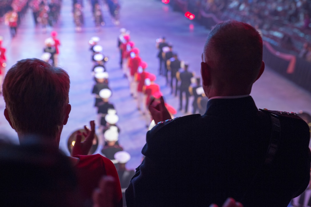U.S. Marine Corps Forces Command Commanding General Lt. Gen. Mark Brilakis, right, applauds during the 2019 Virginia International Tattooat the Norfolk Scope in Norfolk, Virginia, April 26, 2019. This year’s festival was dedicated to women in the military. (U.S. Marine Corps photo by Cpl. Danielle Prentice/ Released)