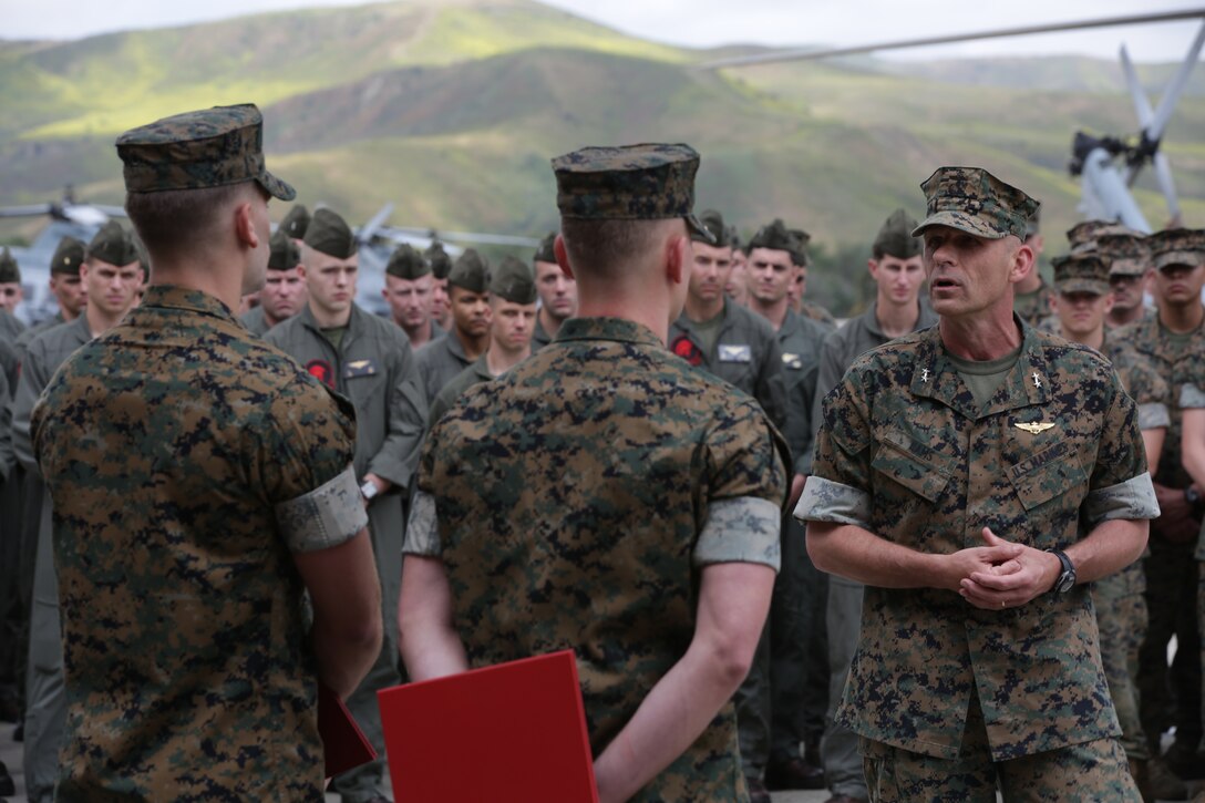Maj. Gen. Kevin M. Iiams, commanding general of 3rd Marine Aircraft Wing, addresses Navy and Marine Corps Medal recipients Sgt. Austin Cox and Sgt. Michael Vura following an awards ceremony at Marine Corps Air Station Camp Pendleton, April 29, 2019. Cox and Vura's quick thinking, exceptional bravery, and selfless actions saved lives and prevented serious bodily harm of innocent bystanders during the Route 91 Harvest Music Festival shooting in Las Vegas, Nev., Oct. 1, 2017. The Navy and Marine Corps Medal is the highest non-combat decoration awarded for heroism by the United States Department of the Navy. (U.S. Marine Corps photo by Lance Cpl. Julian Elliott-Drouin)
