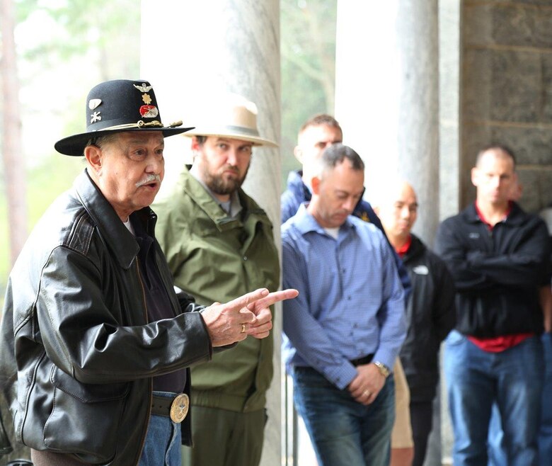 Marines listen to retired Army Maj. Nick Riviezzo as he recounts his prisoner of war experience and the methods he used to escape during his last tour of duty in Vietnam.