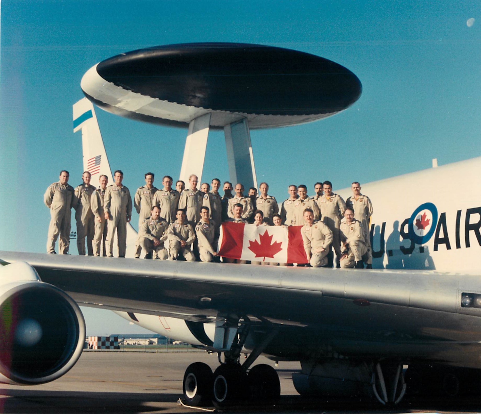 Members of the Canadian Detachment stand aboard the E-3 Sentry AWACS.