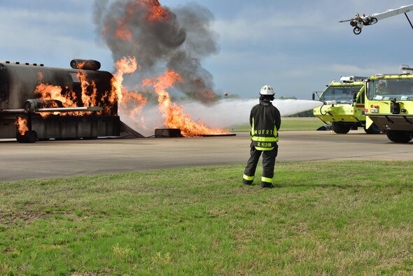 Firemen put out a simulated aircraft fire.