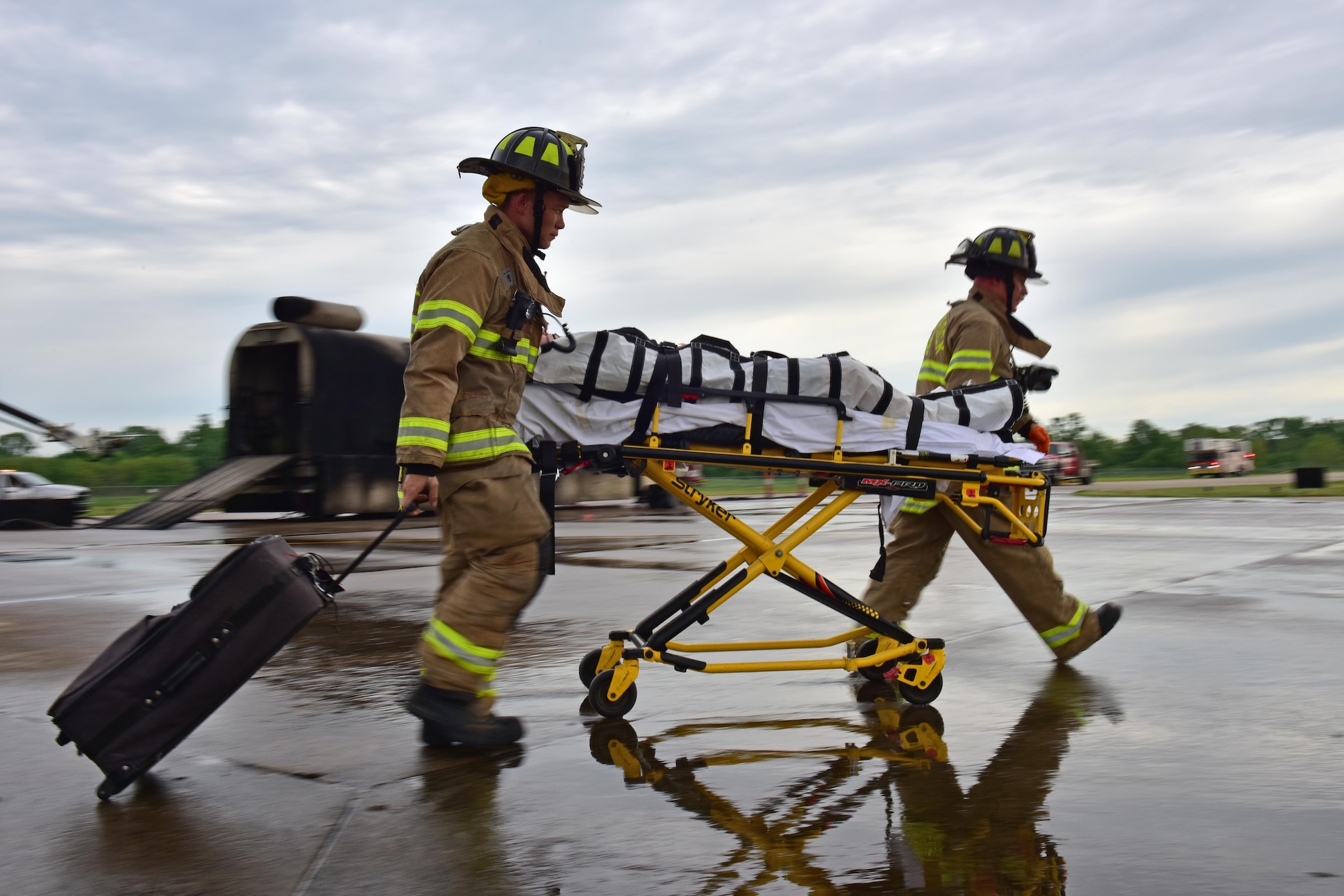 Firemen participate in a mass casualty exercise.
