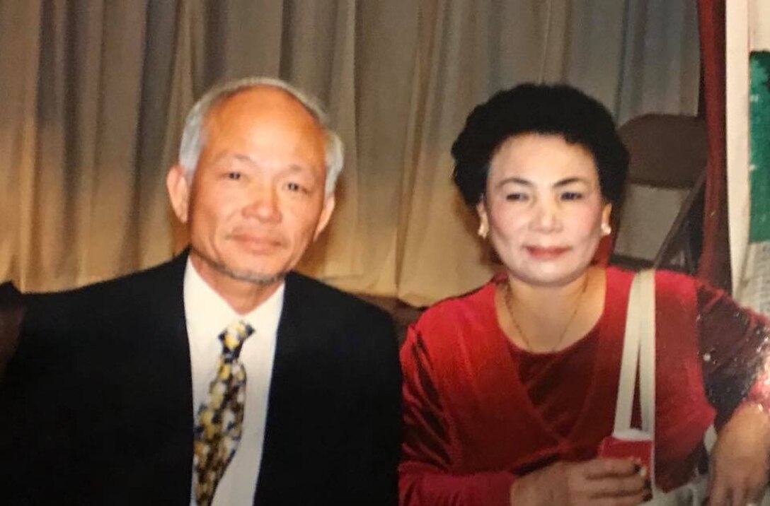 Air Force Reservist Lt. Col. Asan Bui’s parents, Chien Van Bui (left) and Mau Thi Tran (right), at a formal event. According to Bui, his family escaped political persecution at the end of the Vietnam War and resettled in America as refugees. Bui now serves as a communications flight commander with the 920th Rescue Wing, a unit based out of Patrick Air Force Base, Florida. (Courtesy photo)