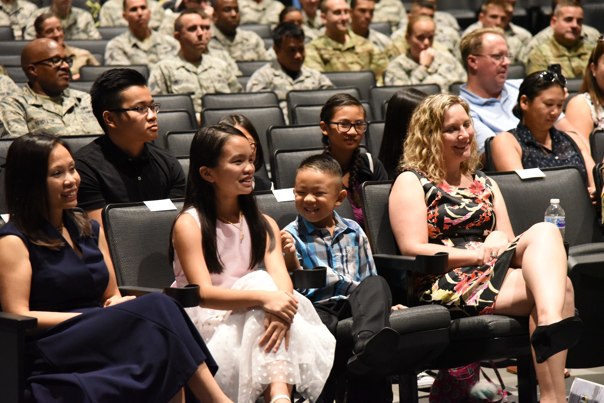 Lt. Col. Asan Bui’s family and friends attend his assumption of command ceremony at Patrick Air Force Base, Florida, on July 14, 2018. The event recognized Bui's transition on becaming the 920th Communications Flight commander.  (U.S. Air Force photo by Senior Airman Brandon Kalloo Sanes)