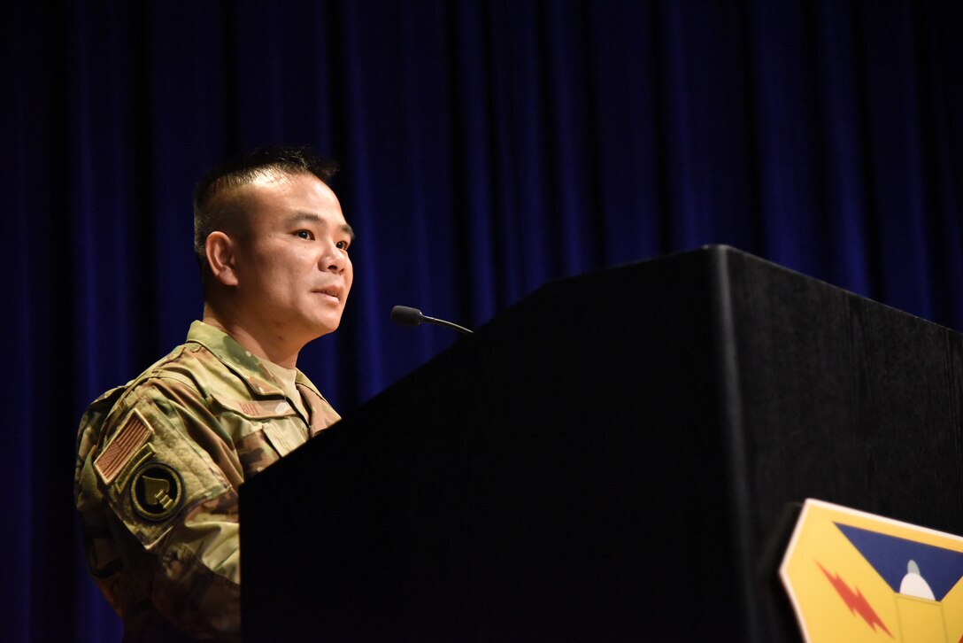 Lt. Col. Asan Bui, addresses his family and friends during his assumption of command ceremony at Patrick Air Force Base, Florida, on July 14, 2018. The event recognized the transition of power as Bui became the 920th Communications Flight commander.  (U.S. Air Force photo by Senior Airman Brandon Kalloo Sanes)