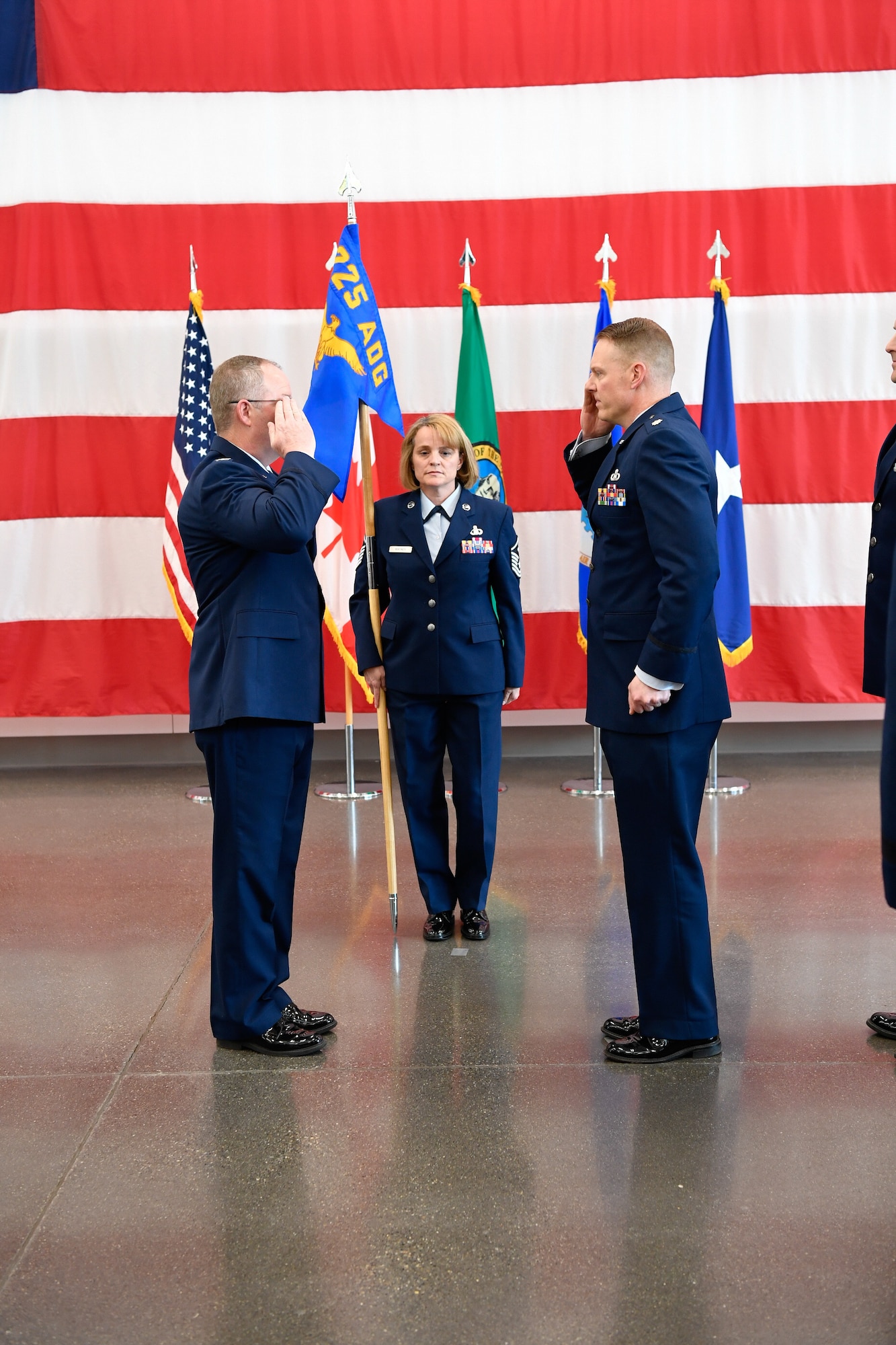 Col. Scott Humphrey presides over the 225th Air Defense Squadron Change of Command ceremony where Col. Brett Bosselmann relinguishes command to Lt. Col. Brian Bergren at the Pierce County Readiness Center, April 10, 2019.