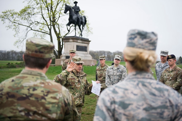 Army Col. Phillip Cuccia, U.S. Army War College academic engagement director, highlights opening actions of the Battle of Gettysburg to U.S. Air Force field grade officers at Gettysburg National Military Park, Pa., April 18, 2019. The officers took a tour of the park during the 2019 Air Force District of Washington Squadron Commander and Spouse Orientation Course to learn about leadership principles from the past, and how they relate to the present. (U.S. Air Force photo by Master Sgt. Michael B. Keller)