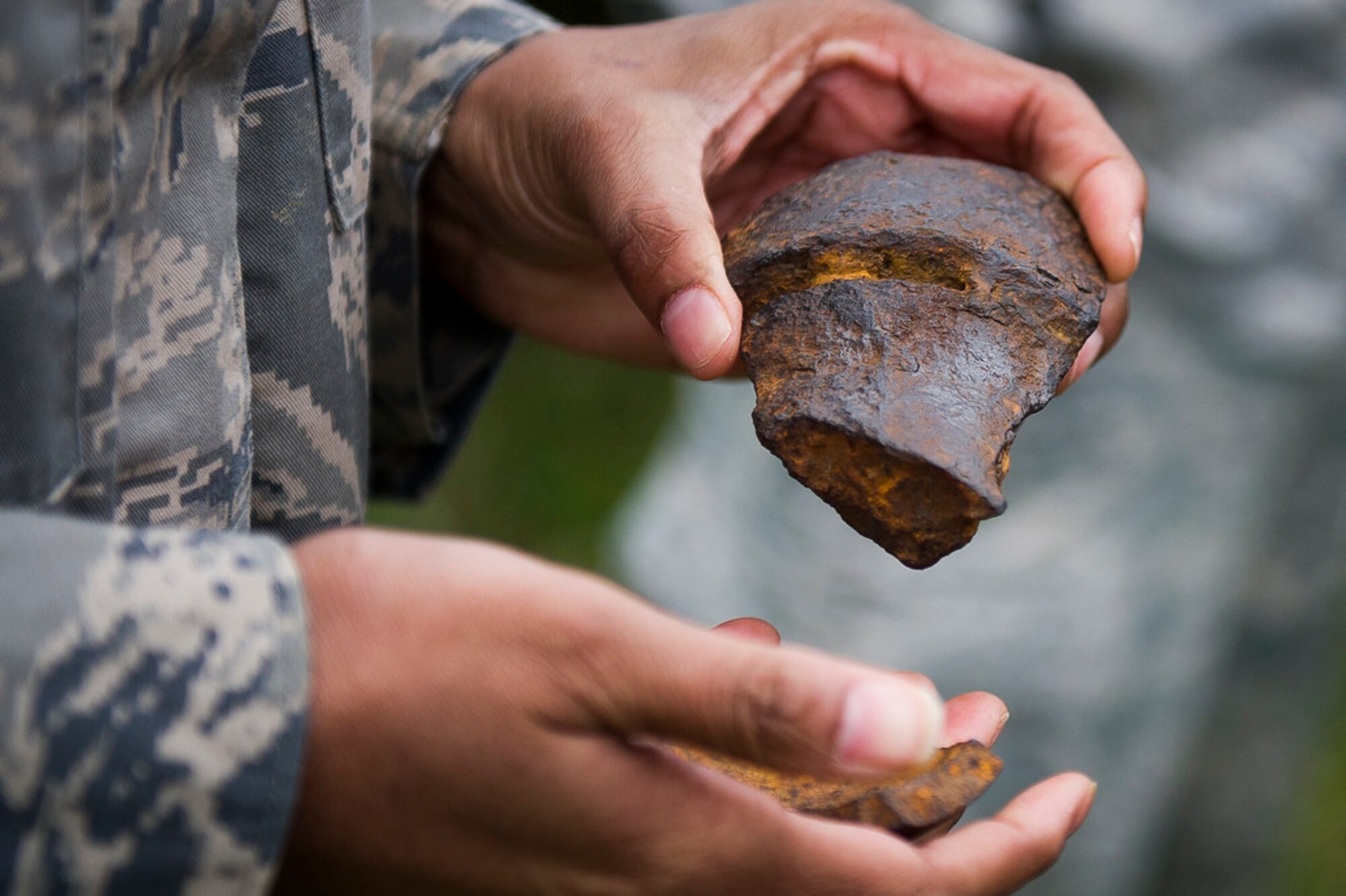 Air Force Master Sgt. Amaani Lyle inspects the remains of Civil War-era ammunition at Gettysburg National Military Park, Pa., April 18, 2019. (U.S. Air Force photo by Master Sgt. Michael B. Keller)