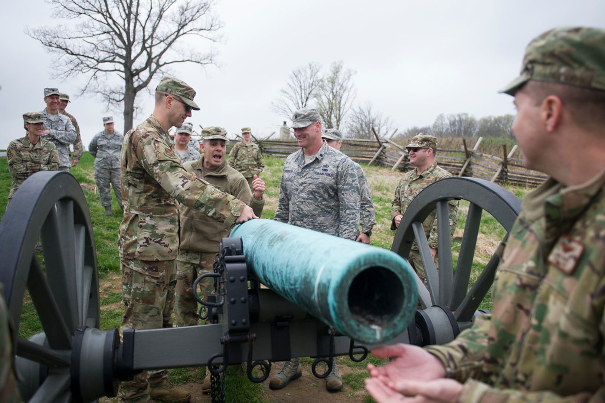 Army Col. Phillip Cuccia, U.S. Army War College academic engagement director, center, goes through the steps of firing a Civil War cannon with U.S. Air Force field grade officers at Gettysburg National Military Park, Pa., April 18, 2019. The Air Force officers took a tour of the park during the 2019 Air Force District of Washington Squadron Commander and Spouse Orientation Course to learn about leadership principles from the past, and how they relate to the present. (U.S. Air Force photo by Master Sgt. Michael B. Keller)