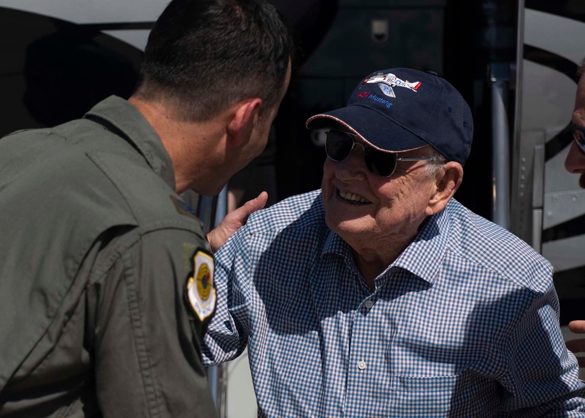 An Airman greets a retiree.