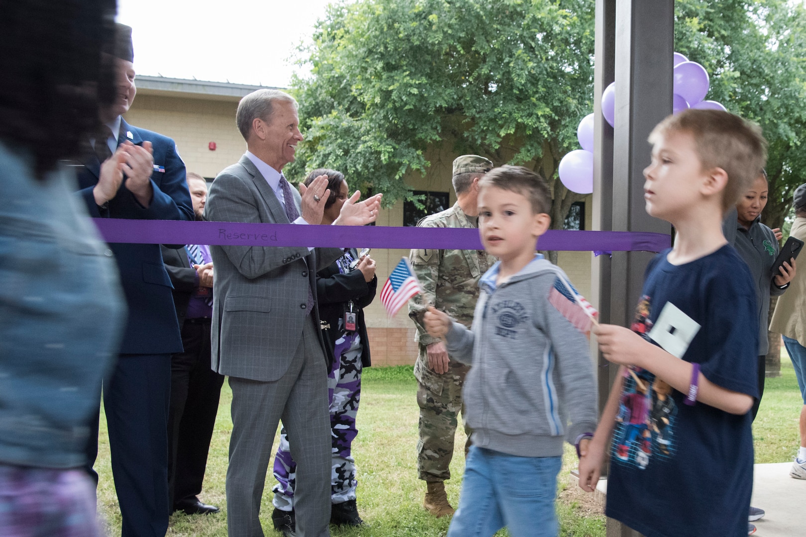 Frank Brogan, Department of Education assistant secretary for elementary and secondary education, cheers during the Lackland Independent School District’s PurpleUp! Parade April 12, 2019, in honor of the Month of the Military Child at Joint Base San Antonio-Lackland, Texas.