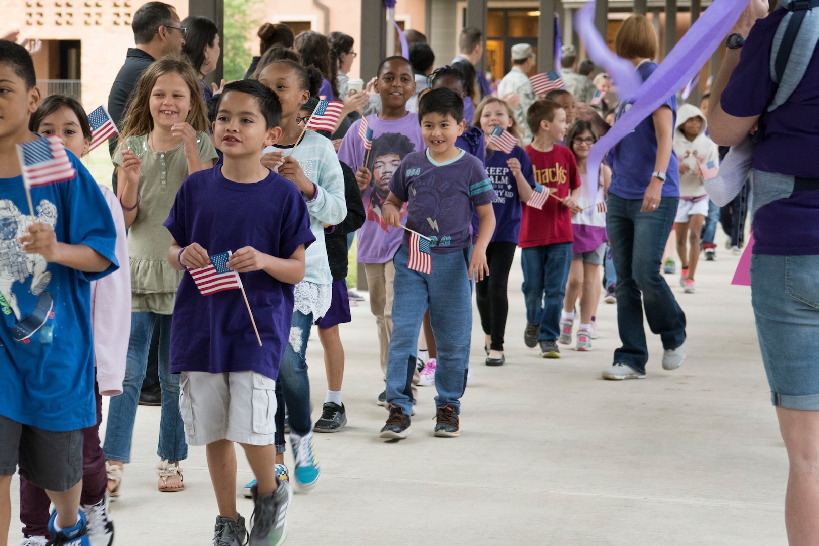 Students at Lackland Independent School District march in the PurpleUp! Parade April 12, 2019, at Joint Base San Antonio-Lackland, Texas.